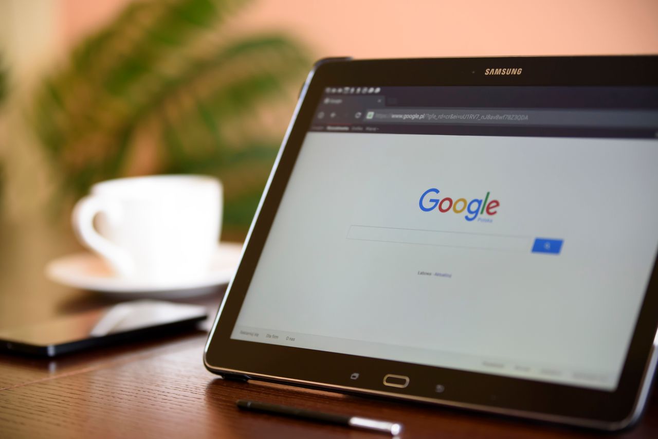 services-03 Samsung tablet on desk showing Google homepage, perfect for technology-related content.